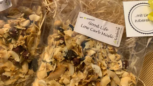 Bag of Good Life Low Carb Muesli with dried nuts and seeds on straw background