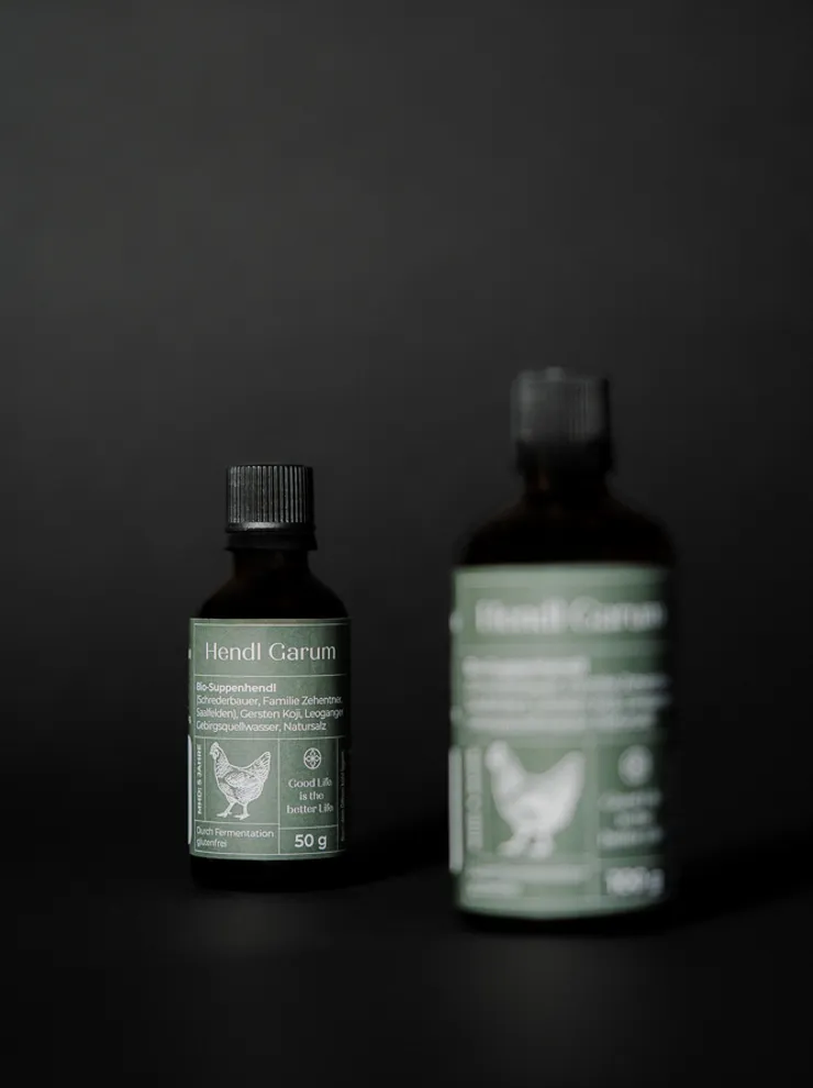 Hendl Carum organic chicken broth concentrate bottles on dark background